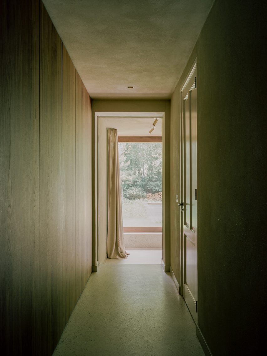Brick extension opens rural Dutch home out towards a forested garden