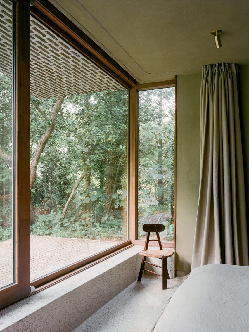 Brick extension opens rural Dutch home out towards a forested garden