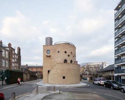 Rounded building in pale brick