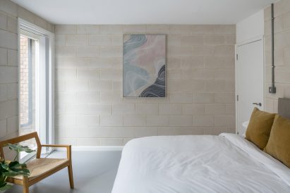 Bedroom with exposed blockwork walls