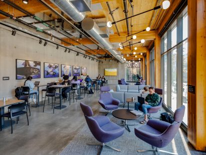 Students in mass timber building lobby