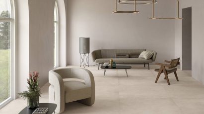 Geo tiles by Ceramiche Keope in a neutral living room with arched windows