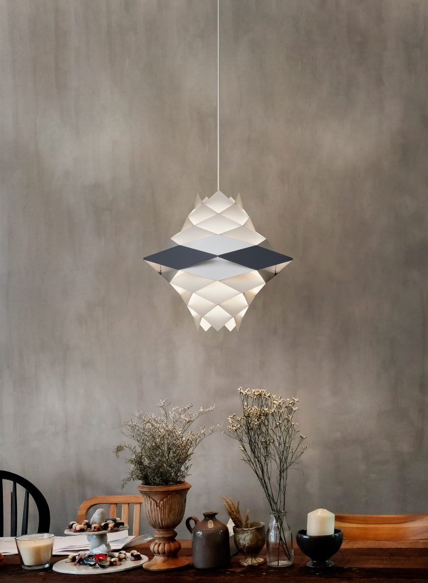 Photograph showing lamp above dining table