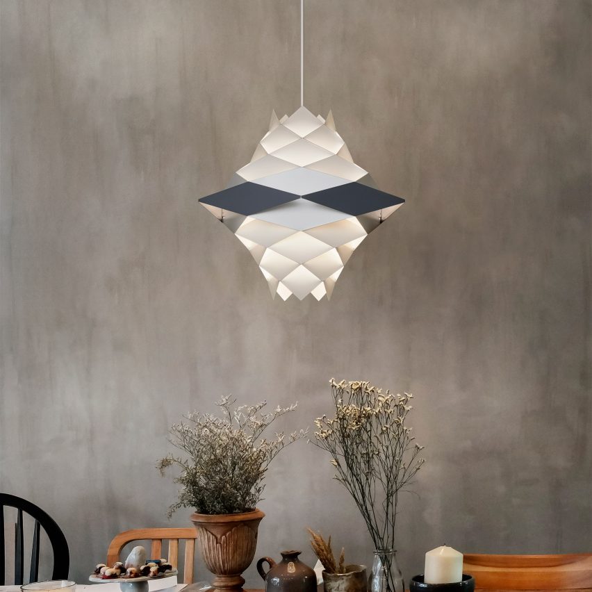Photograph showing lamp above dining table