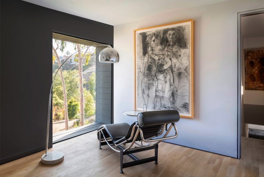 A chaise lounge in front of a window