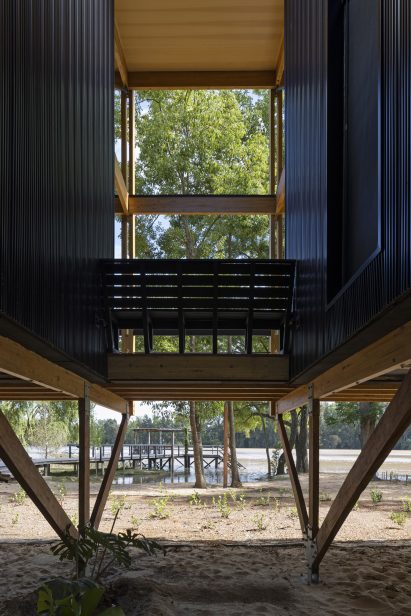 Stilts under black timber house
