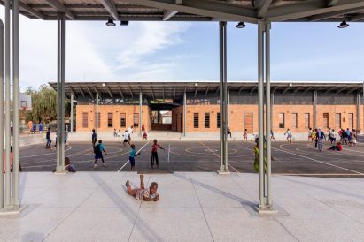Children playing at sports court in Uganda