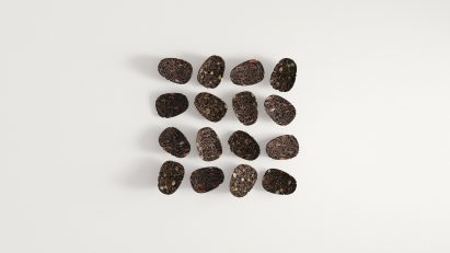 Rendering of 16 Keia Ayahuasca Pucks for microdosing made of compressed tea leaves
