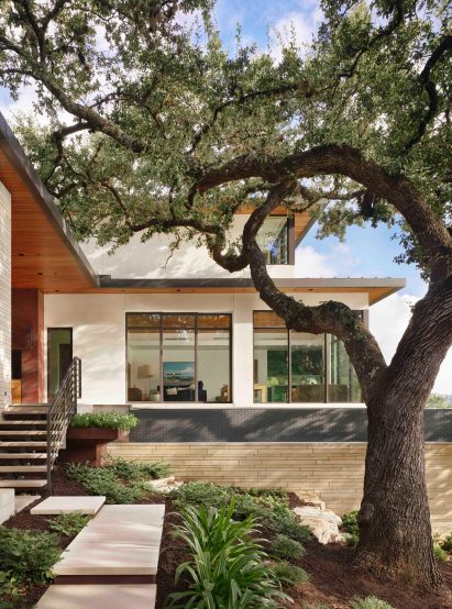 La Rue Architects copper house with tree in foreground