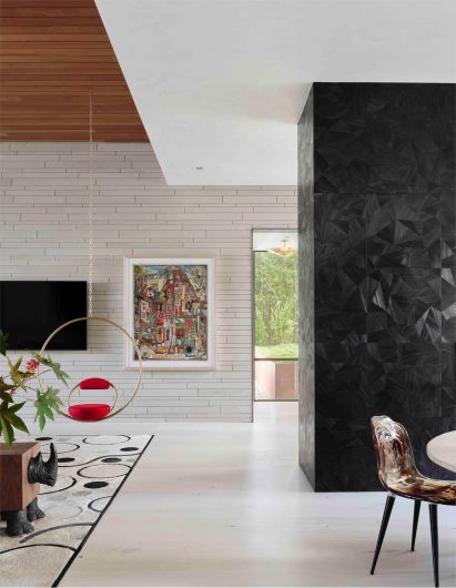 LaRue architects Austin Lake house with hanging red chair