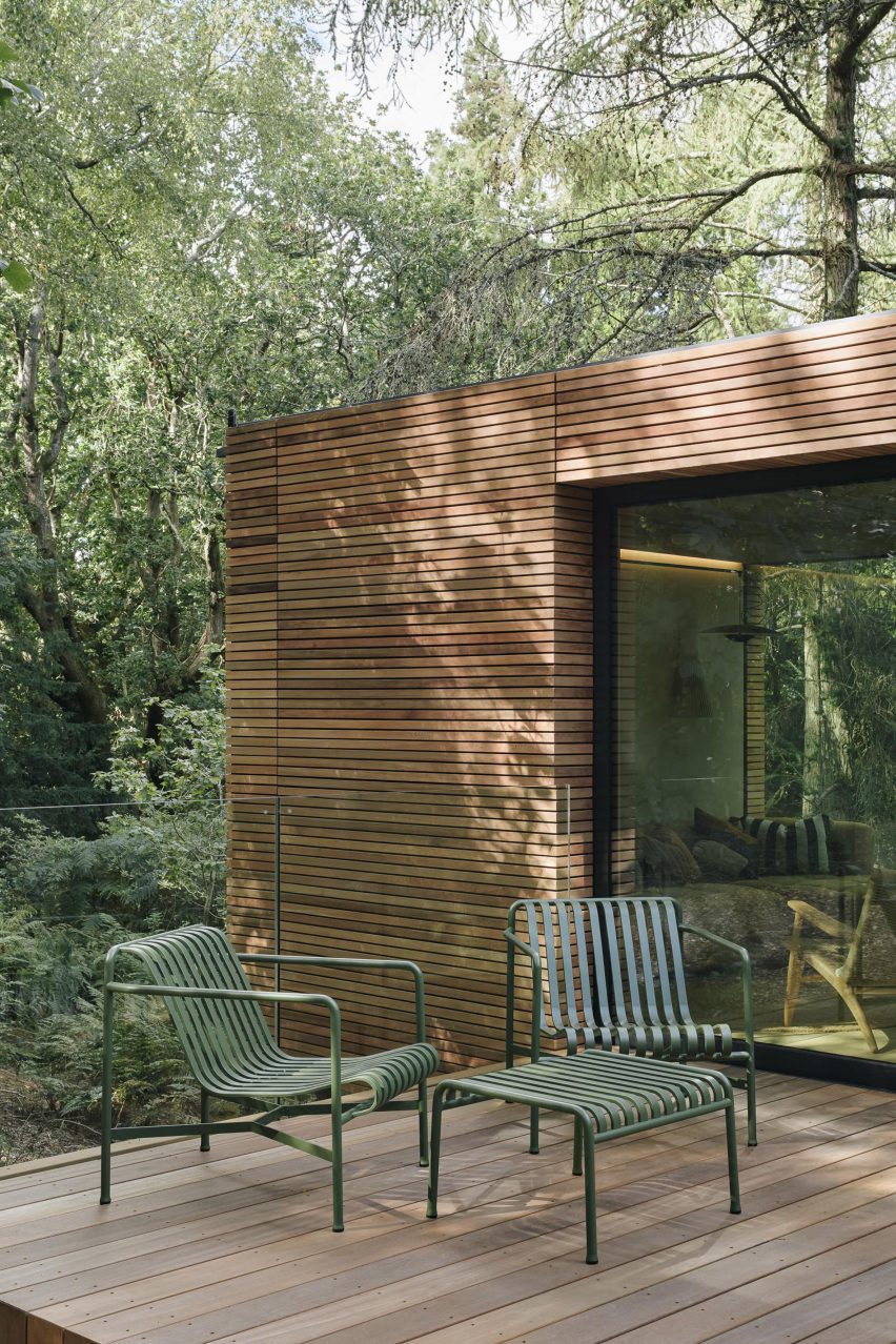 Exterior of wooden cabin with wooden deck