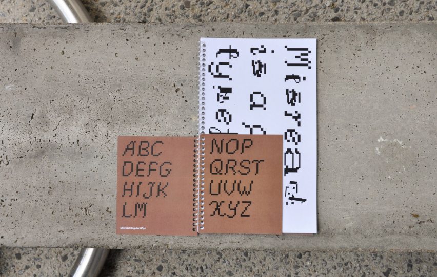 Text on white and brown paper on concrete background