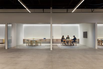 Offices with glass walls and industrial ceilings
