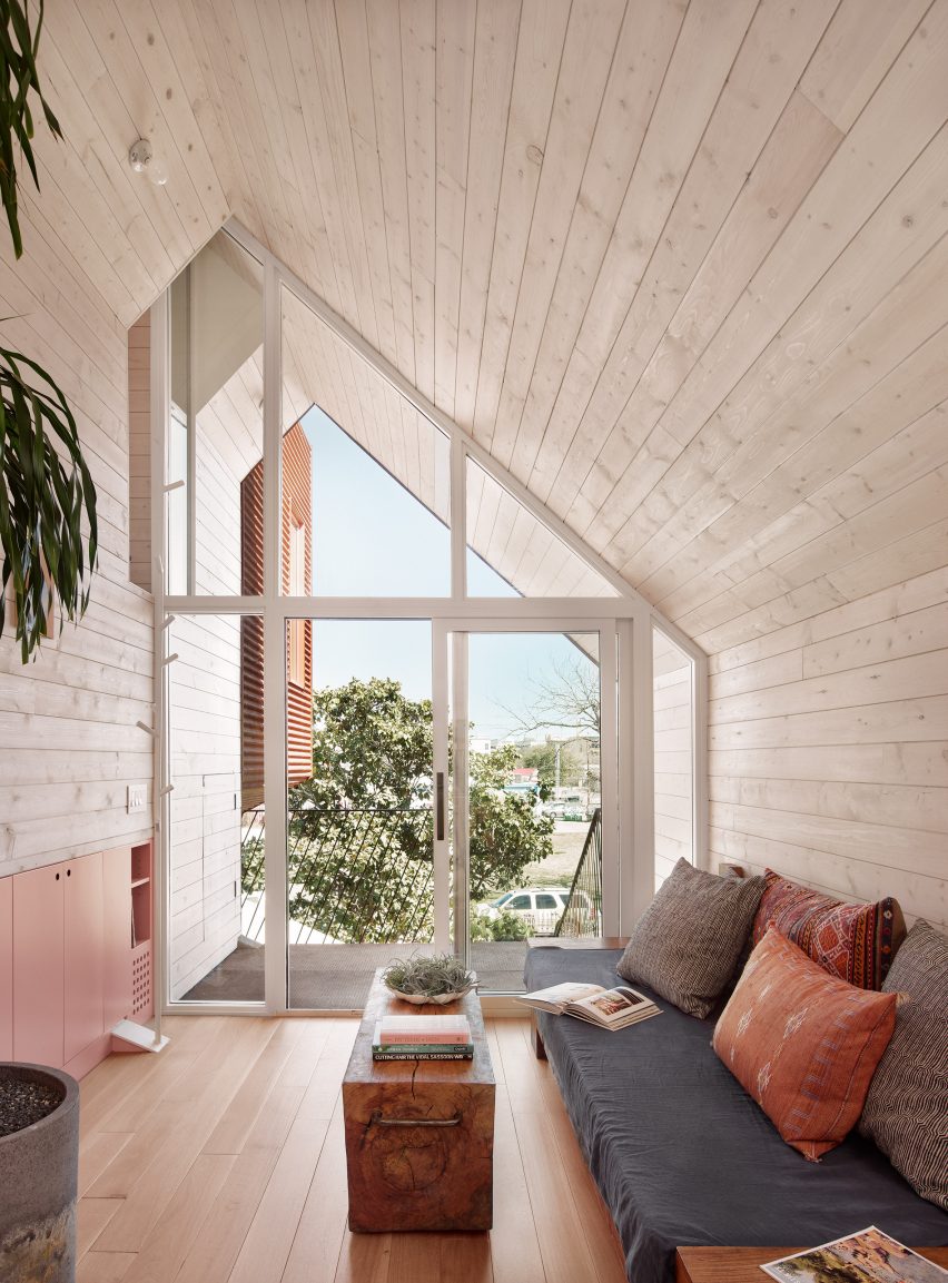 A cosy living room with floor-to-ceiling windows
