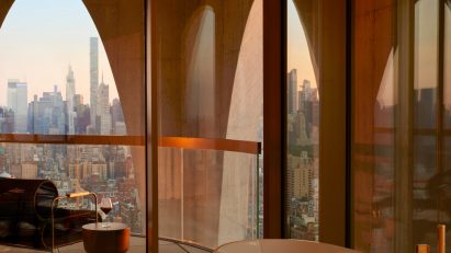 Bathroom with arch-framed view of Manhattan