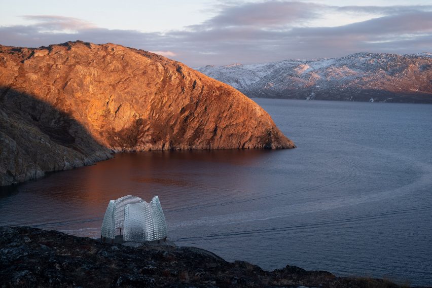 Qaammat pavilion by Konstantin Arkitekter on a rocky hillside overlooking a lake