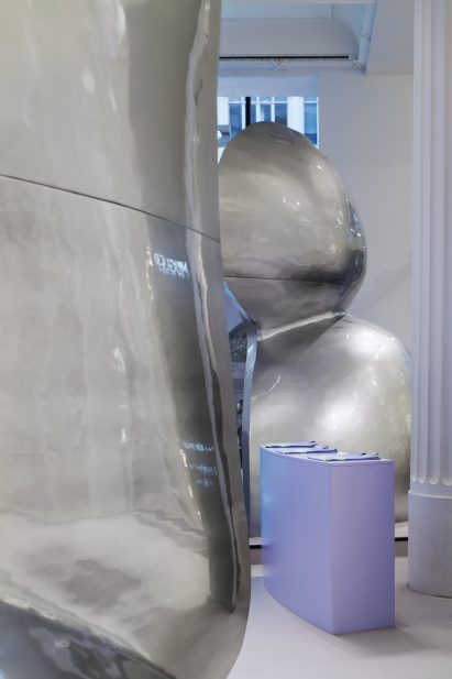Interior image of metal-effect partitions at the Mugler pop-up