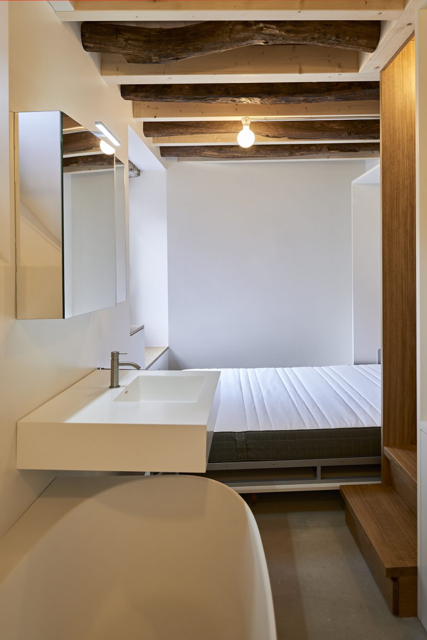Bedroom and bathroom in Rustic Renovation by Enrico Sassi