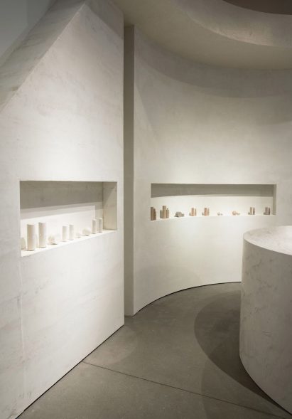 Neutral coloured concrete walls inside a shop