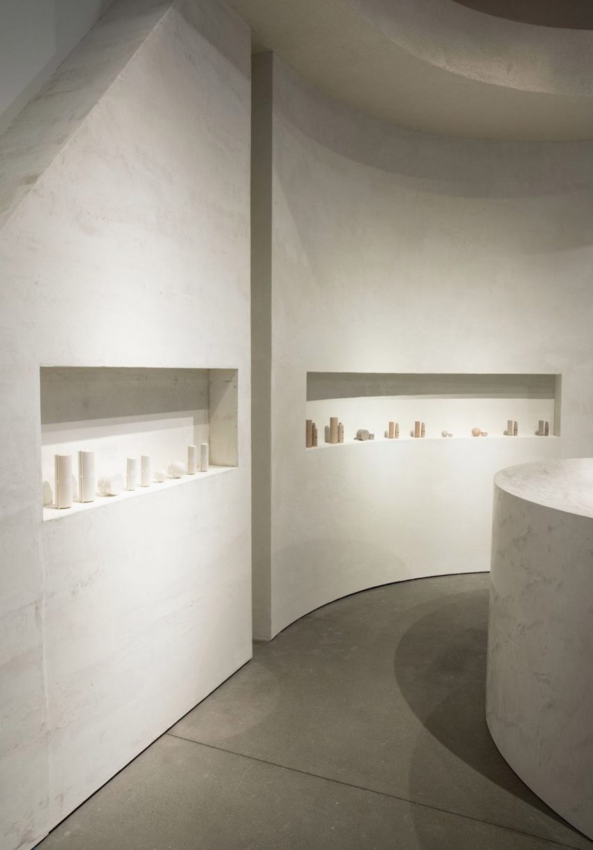 Neutral coloured concrete walls inside a shop