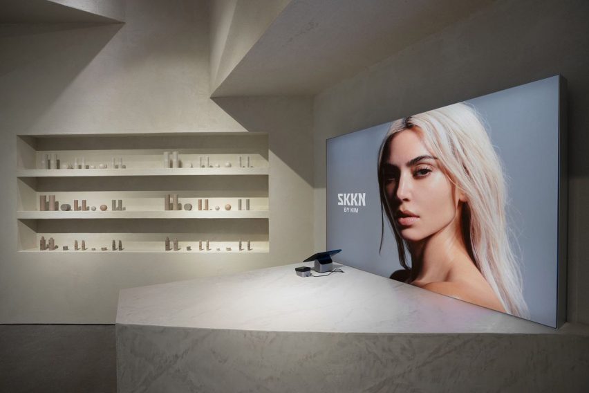 A portrait photo of Kim Kardashian in a store