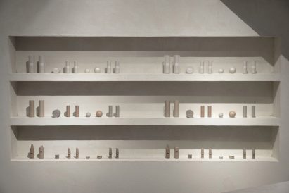 Skincare products on cream coloured shelves