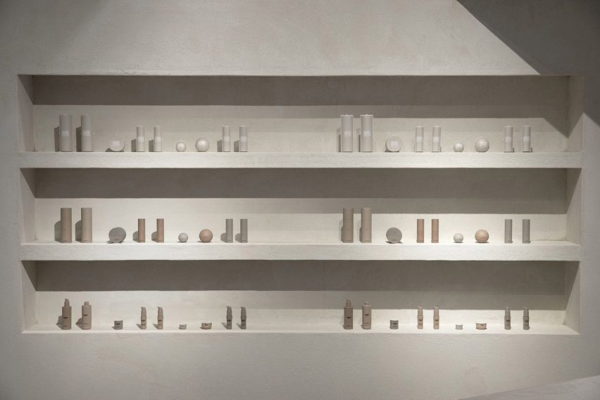 Skincare products on cream coloured shelves