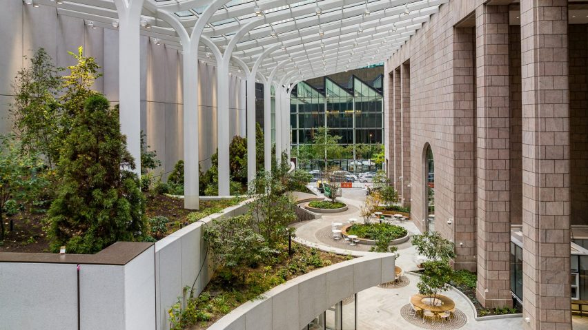 Courtyard with greenery and galzed canopy