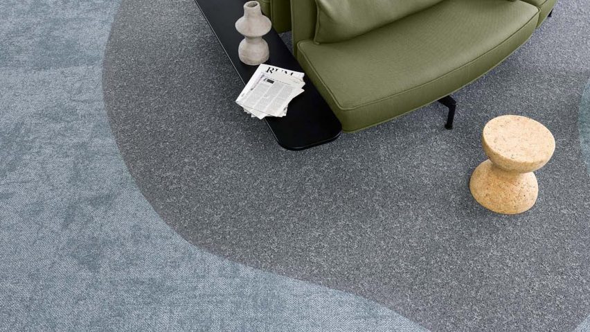 Photograph of blue carpet beneath sofa
