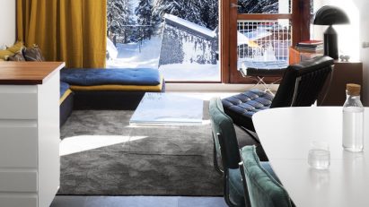 An open plan living and dining room with Bauhaus colours