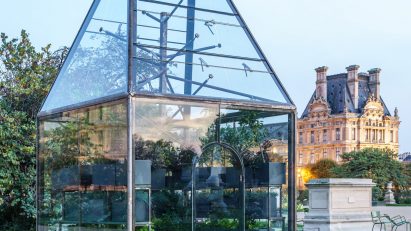 Glass pavilion with trapezoidal roof