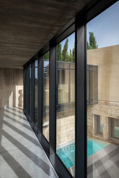 Glazed walkway in The Mill House by Valentino Architects