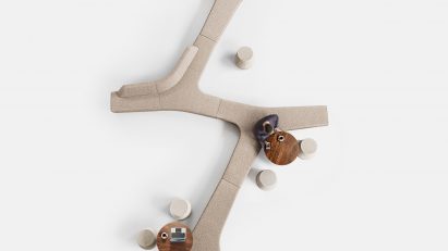 Beige seating on white backdrop from above