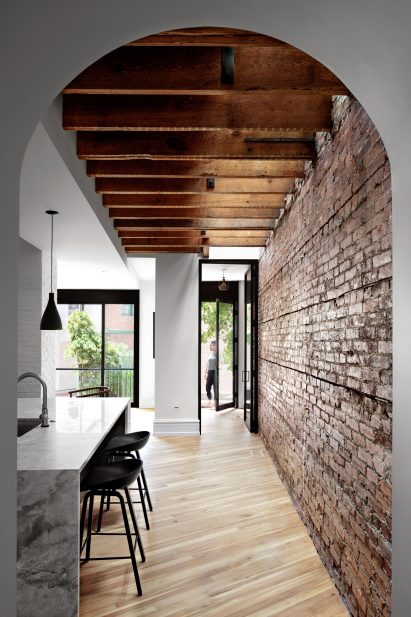 View through arched corridor to the back of the house