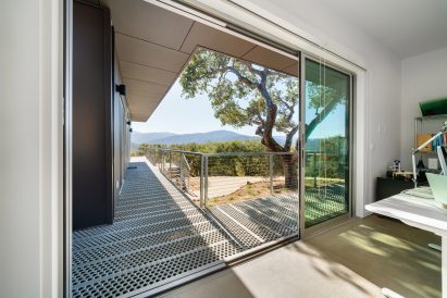 Metal walkway and opening in Carmel Valley home