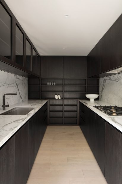 Dark wood kitchen with stone counter tops
