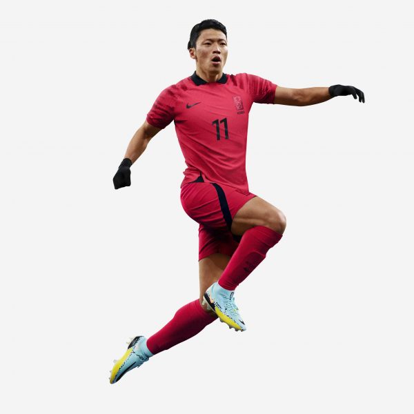 A footballer in a red kit