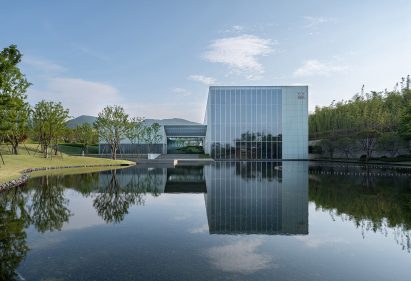 Blocky theatre beside water in China
