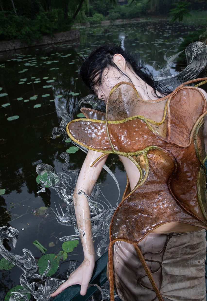 A model in a forest wearing a corset