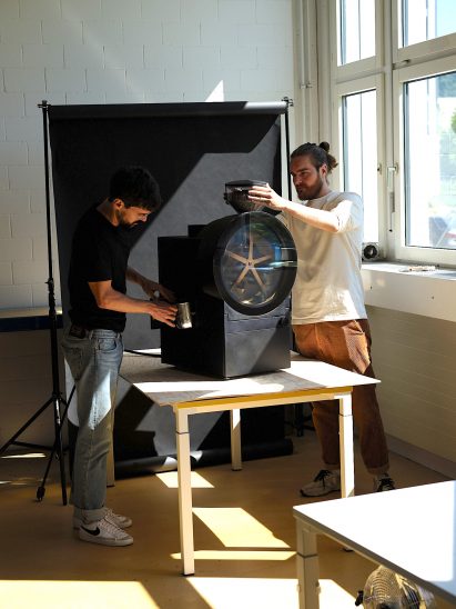 Two people with coffee machine