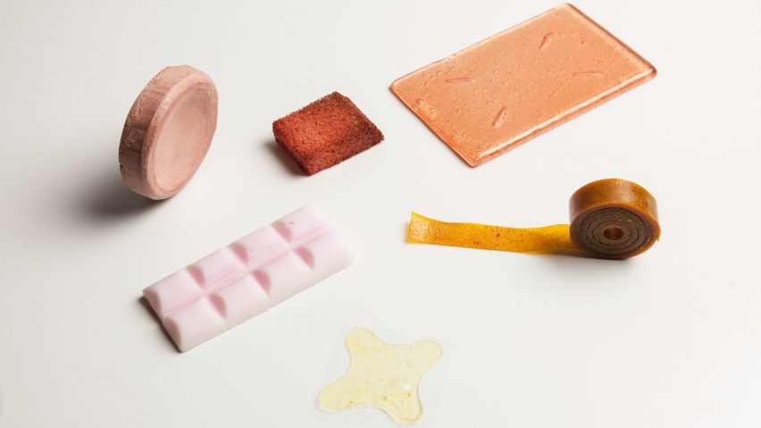 Photograph of pastel coloured skincare items on white background