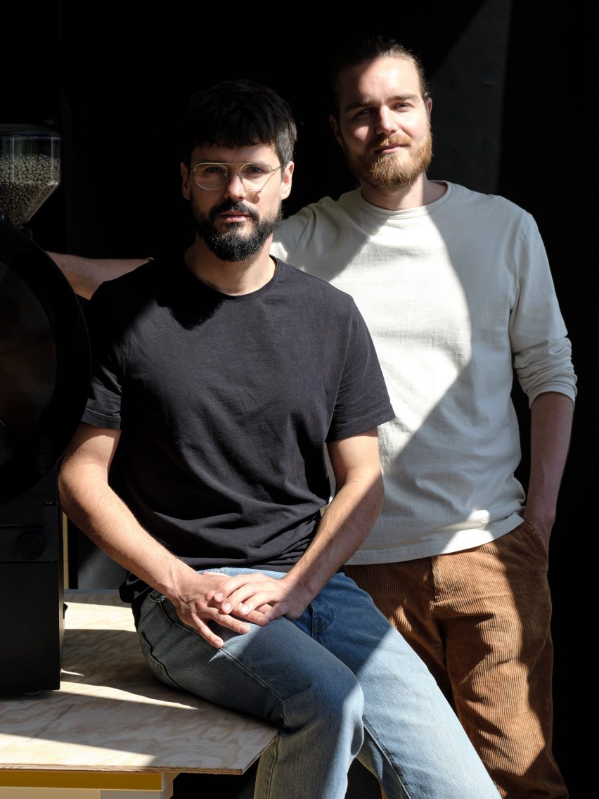 Two people with coffee machine