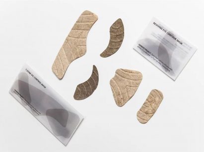 Photograph of neutral coloured skincare items on white background
