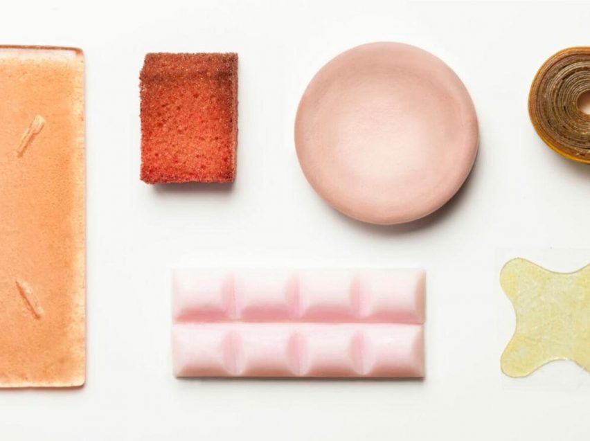 Photograph of pastel coloured skincare items on white background