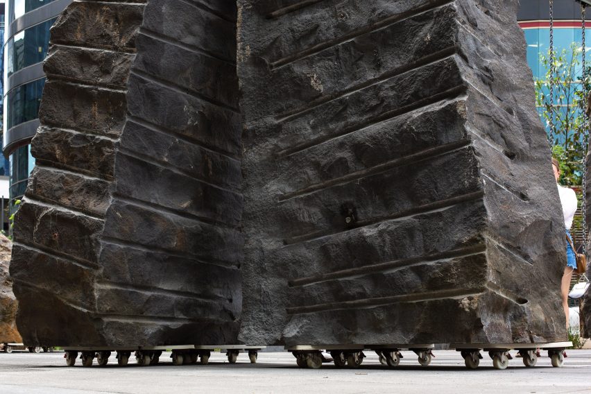 Rough hewn bluestone boulders of Mike Hewson's Rocks on Wheels playground sculpture in Melbourne