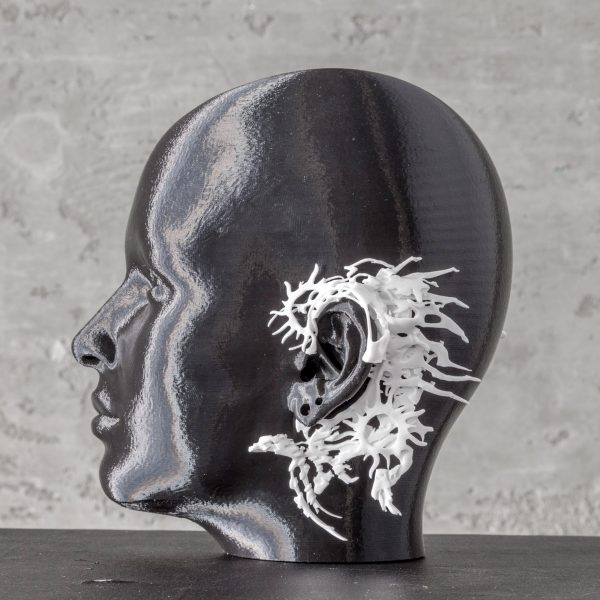 Model with jewellery design around ear