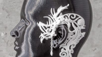 Model with a jewellery design resting on ear