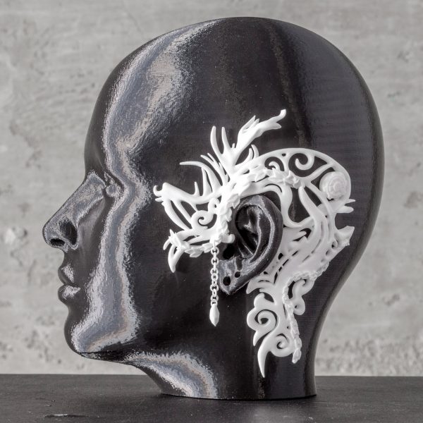 Model with a jewellery design resting on ear