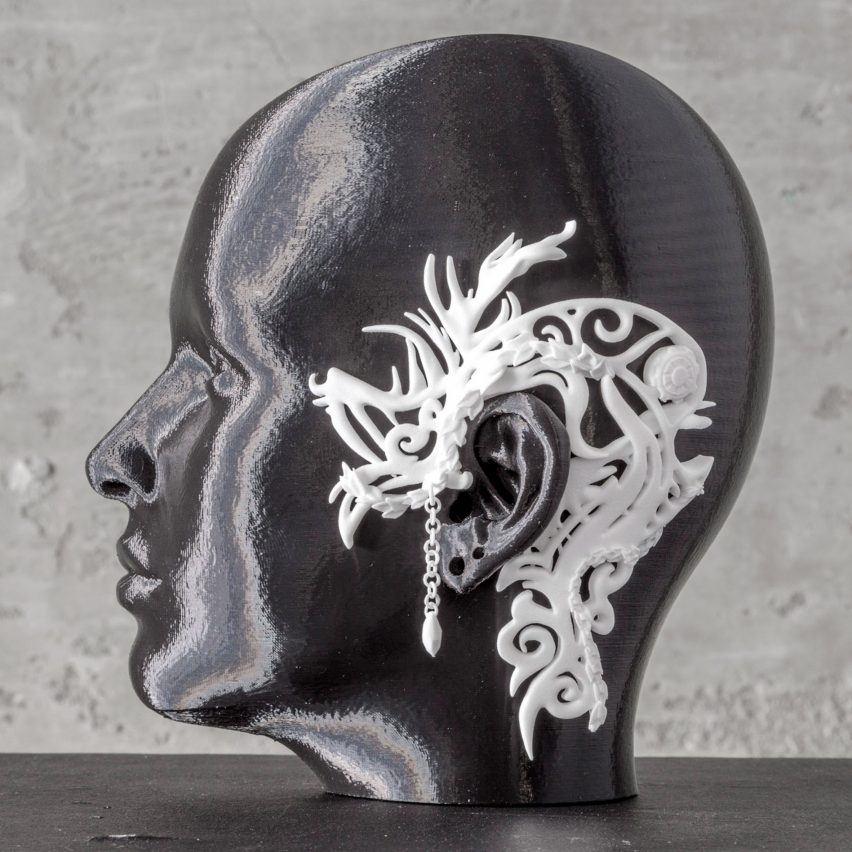 Model with a jewellery design resting on ear