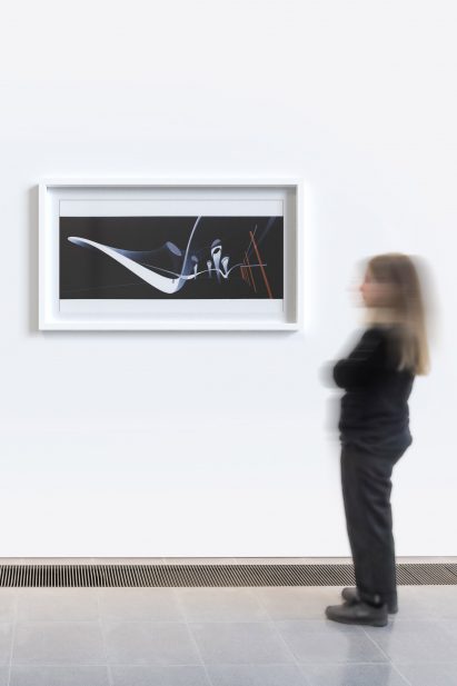 Someone standing by the wave print